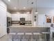 Kitchen with granite countertops, stainless steel appliances, and island seating at 2660 Sunrise Shores Dr, Kissimmee, FL 34747
