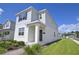 Charming two-story home with a well-maintained lawn and inviting front entrance at 3027 Addison Blvd, St Cloud, FL 34771