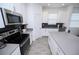 Well-equipped kitchen with stainless steel appliances and ample counter space at 3027 Addison Blvd, St Cloud, FL 34771