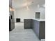 Modern kitchen featuring an island, stainless steel appliances, and pendant lighting at 3082 Se 140Th Ln, Summerfield, FL 34491