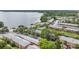 Scenic aerial shot showcases lakeside apartments, green spaces, and parking at 316 Georgetown Dr # 316, Casselberry, FL 32707