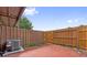 Enclosed backyard area featuring a wood fence and access gate and a patio with AC unit at 316 Georgetown Dr # 316, Casselberry, FL 32707