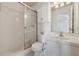 Clean bathroom featuring shower, vanity with sink, and toilet; tile floor and storage available at 316 Georgetown Dr # 316, Casselberry, FL 32707