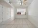 Well-lit dining room with tile floors and view through to an adjacent living area at 316 Georgetown Dr # 316, Casselberry, FL 32707