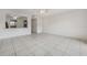 Open-concept living room with tile flooring, neutral paint, and natural light at 316 Georgetown Dr # 316, Casselberry, FL 32707