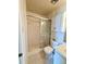 Well-lit bathroom with shower and tile flooring, vanity and storage at 316 Georgetown Dr, Casselberry, FL 32707