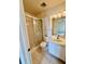 Well-lit bathroom with shower and tile flooring, vanity and storage at 316 Georgetown Dr, Casselberry, FL 32707