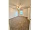 Bedroom with neutral carpet, a ceiling fan and a bright window at 316 Georgetown Dr, Casselberry, FL 32707