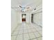 Open dining room with tile flooring and ceiling fan, seamlessly connected to the kitchen for easy serving at 316 Georgetown Dr, Casselberry, FL 32707