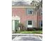 Close-up view of a brick condo with green shutters and a well-maintained front entrance at 316 Georgetown Dr, Casselberry, FL 32707