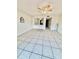 Open-concept living room with tile flooring and ceiling fan, providing a versatile and comfortable living space at 316 Georgetown Dr, Casselberry, FL 32707