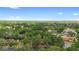 Expansive aerial view of neighborhood featuring lush greenery, neighborhood homes and parking at 4045 Crossroads Pl, Casselberry, FL 32707
