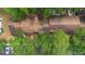 Aerial view of townhomes showing the roof and surrounding greenery at 4045 Crossroads Pl, Casselberry, FL 32707