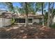 Private backyard with mature trees, perfect for outdoor activities and relaxation at 4045 Crossroads Pl, Casselberry, FL 32707