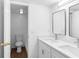 Bright bathroom with double vanity, modern fixtures, and a separate shower area at 4045 Crossroads Pl, Casselberry, FL 32707