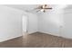 Bedroom with wood-look vinyl flooring, ceiling fan and neutral walls at 4045 Crossroads Pl, Casselberry, FL 32707