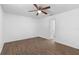 Bedroom with neutral walls, ceiling fan, and wood-look vinyl floors at 4045 Crossroads Pl, Casselberry, FL 32707