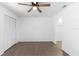 Spacious bedroom with vinyl flooring, ceiling fan, and a large closet at 4045 Crossroads Pl, Casselberry, FL 32707