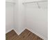 Spacious walk-in closet featuring hardwood floors and wire shelving ready for storage and organization at 4045 Crossroads Pl, Casselberry, FL 32707