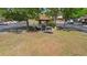 A gazebo in a community common area, surrounded by mature trees and parking spaces at 4045 Crossroads Pl, Casselberry, FL 32707