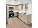 Bright kitchen featuring stainless steel appliances, light wood cabinets, and white countertops at 4045 Crossroads Pl, Casselberry, FL 32707