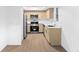 Bright kitchen featuring stainless steel appliances, light wood cabinets, and white countertops at 4045 Crossroads Pl, Casselberry, FL 32707