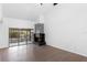 Bright living room features a modern fireplace and sliding glass doors to the outdoor area at 4045 Crossroads Pl, Casselberry, FL 32707