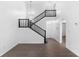 Bright living room featuring high ceilings, wood-look flooring, and staircase at 4045 Crossroads Pl, Casselberry, FL 32707