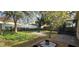 Fenced backyard with grass and landscaped area at 4102 Feldspar Trl, Orlando, FL 32826