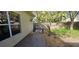 A view of the backyard featuring a brick patio and manicured landscaping at 4102 Feldspar Trl, Orlando, FL 32826