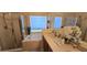 Bright bathroom featuring a large soaking tub, shower, and dual sink vanity with plenty of storage at 4102 Feldspar Trl, Orlando, FL 32826