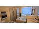 Bright bathroom featuring a large soaking tub, glass shower, and white tiled floor at 4102 Feldspar Trl, Orlando, FL 32826