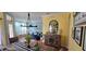 Open-concept dining area leading to a living room with blue couch at 4102 Feldspar Trl, Orlando, FL 32826