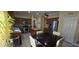 Bright kitchen features stainless steel appliances, wood cabinets and an island with seating at 4102 Feldspar Trl, Orlando, FL 32826