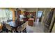 Bright kitchen with stainless appliances, island, and view to the dining room at 4102 Feldspar Trl, Orlando, FL 32826