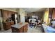 Modern kitchen with stainless steel appliances open to dining area at 4102 Feldspar Trl, Orlando, FL 32826
