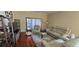Cozy living room with neutral decor, hardwood floors, and ample seating at 4102 Feldspar Trl, Orlando, FL 32826