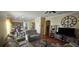Inviting open-concept living space with seamless flow from kitchen and living room at 4102 Feldspar Trl, Orlando, FL 32826