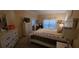Comfortable main bedroom with a dresser, television and matching bedside lamps providing ambient light at 4102 Feldspar Trl, Orlando, FL 32826