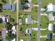 Aerial view of neighborhood with a house that has a gazebo behind it and an adjacent building at 413 5Th S St, Dundee, FL 33838