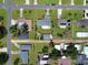 Overhead view of houses in the neighborhood, including the subject property with an adjacent gazebo at 413 5Th S St, Dundee, FL 33838