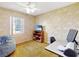 Bedroom features ceiling fan, desk space, and natural light at 413 5Th S St, Dundee, FL 33838