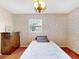 Charming bedroom featuring soft colors, vintage wallpaper and great light at 413 5Th S St, Dundee, FL 33838