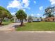 Charming single-story home with well-manicured lawn and mature trees at 413 5Th S St, Dundee, FL 33838