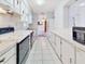 Bright kitchen with white cabinets, long countertops, and efficient appliances at 413 5Th S St, Dundee, FL 33838