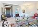 A well-lit foyer with a grand wooden front door and view through the home's interior at 502 Canopy Ln, Lady Lake, FL 32159