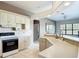 Open concept kitchen with updated appliances and a view into the living area at 502 Canopy Ln, Lady Lake, FL 32159