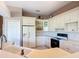 Bright kitchen with white cabinets, modern appliances, and plenty of counter space at 502 Canopy Ln, Lady Lake, FL 32159