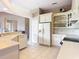 Clean kitchen with white cabinetry, tiled floors, and modern appliances at 502 Canopy Ln, Lady Lake, FL 32159