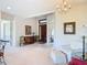 Spacious living room featuring neutral tones, a large front door, and ample natural light at 502 Canopy Ln, Lady Lake, FL 32159